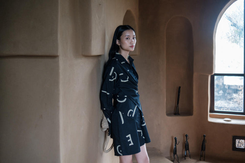 Seattle Wrap Shirt Dress-Black triangle printed cotton by The Terra Tribe in black color for women in Singapore