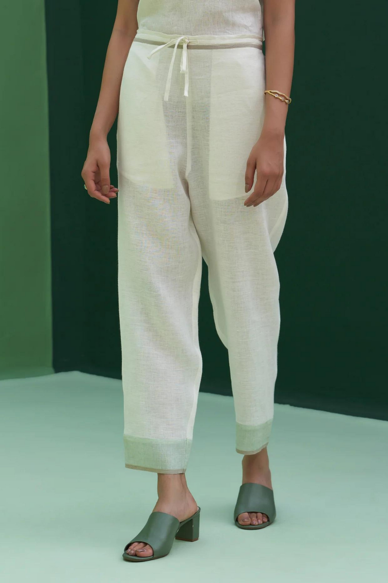 Inawi Border Linen Pant
- Ivory linen by Manan in ivory color for women in Singapore