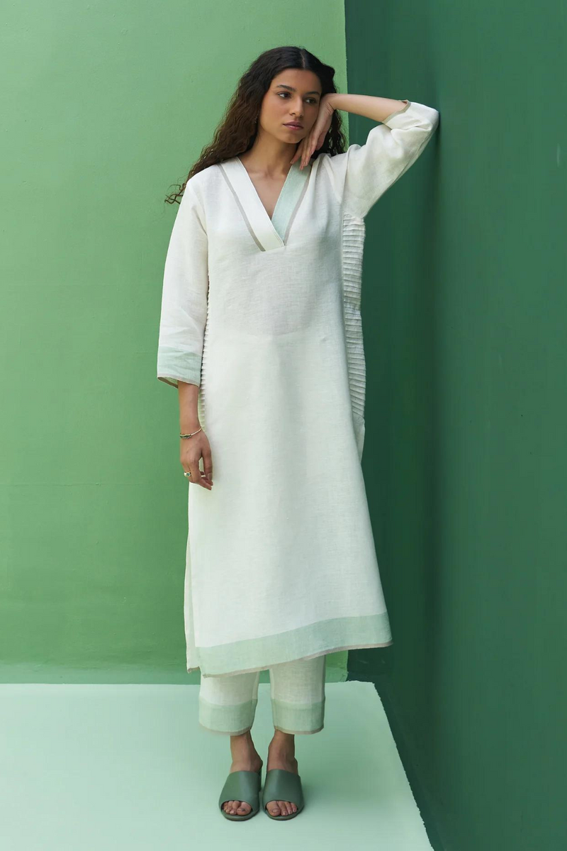 June Border Linen Pleated Kurta
- Ivory linen by Manan in ivory color for women in Singapore