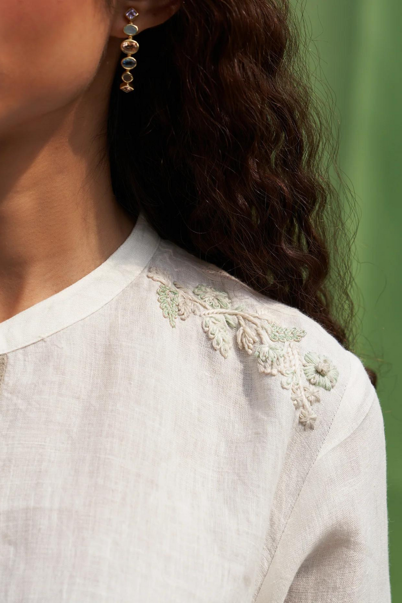 Noi Hand-Embroidered Linen Top
- Ivory linen by Manan in ivory color for women in Singapore