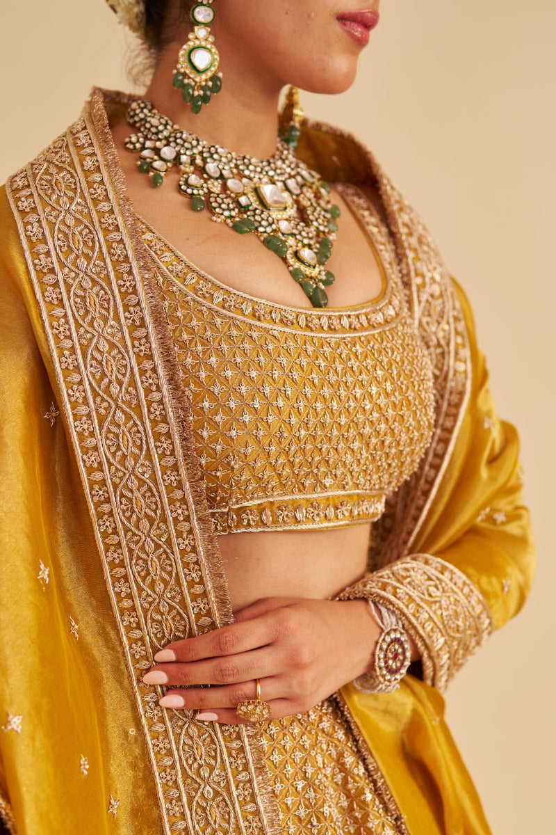 Aashina - Dabka Zardozi Embroidered Pure Tissue Mustard Lehenga Set silk by SHEETAL BATRA in gold color for women in Singapore