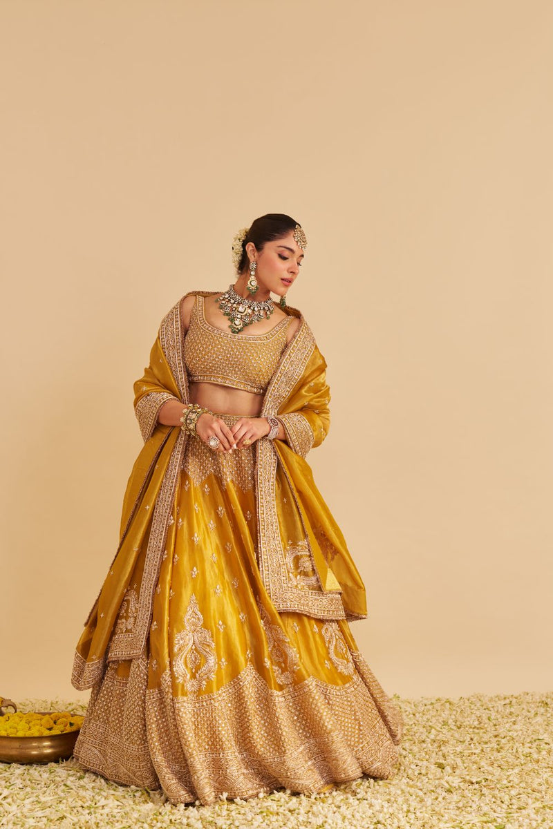 Aashina - Dabka Zardozi Embroidered Pure Tissue Mustard Lehenga Set silk by SHEETAL BATRA in gold color for women in Singapore
