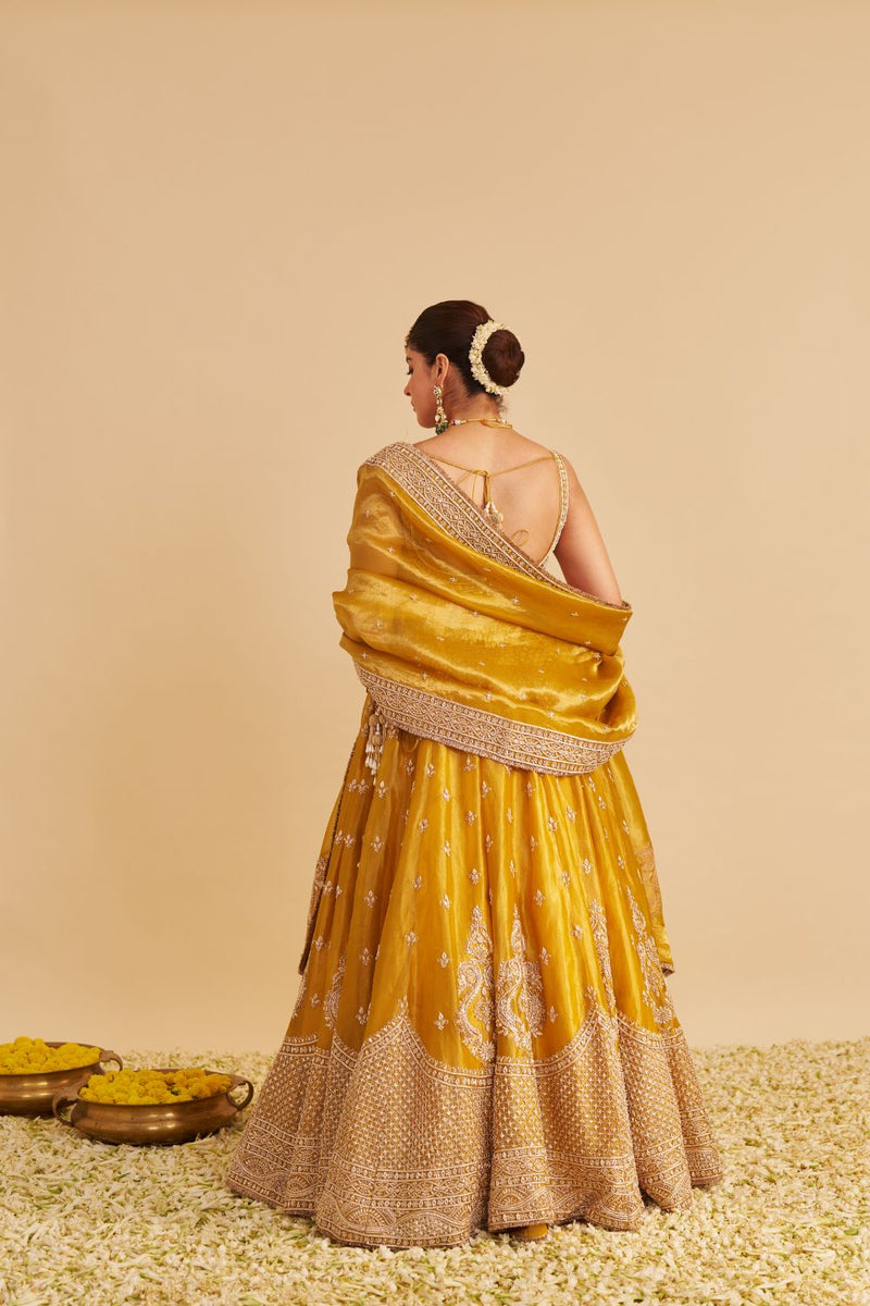 Aashina - Dabka Zardozi Embroidered Pure Tissue Mustard Lehenga Set silk by SHEETAL BATRA in gold color for women in Singapore