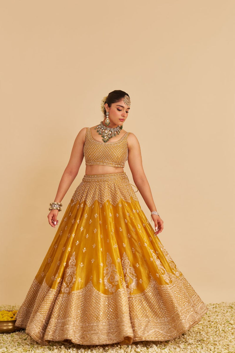 Aashina - Dabka Zardozi Embroidered Pure Tissue Mustard Lehenga Set silk by SHEETAL BATRA in gold color for women in Singapore