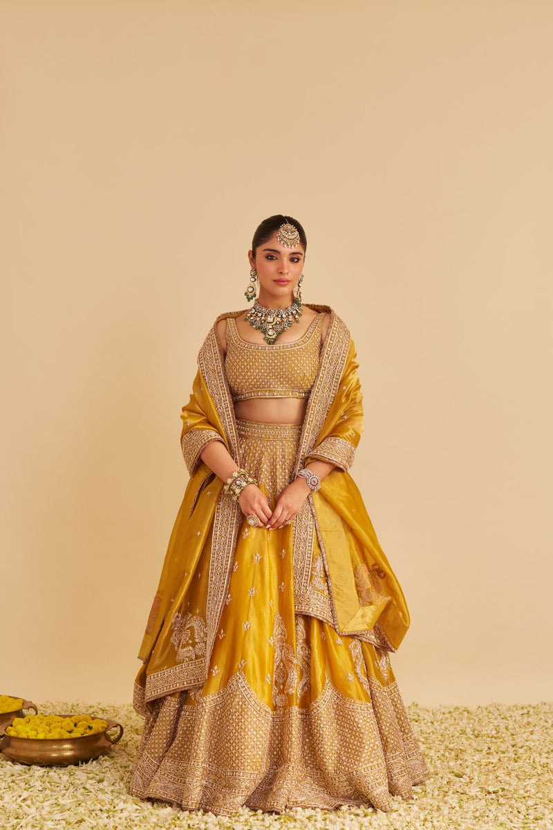 Aashina - Dabka Zardozi Embroidered Pure Tissue Mustard Lehenga Set silk by SHEETAL BATRA in gold color for women in Singapore