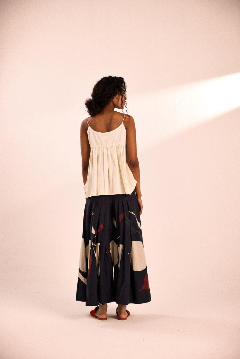 Aba pleated pants by Khara Kapas in black for women in Singapore