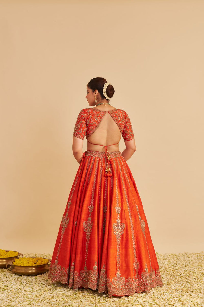 Naazila - Dabka Zardozi Embroidered Raw Silk Burnt Orange Lehenga Set silk by SHEETAL BATRA in orange color for women in Singapore