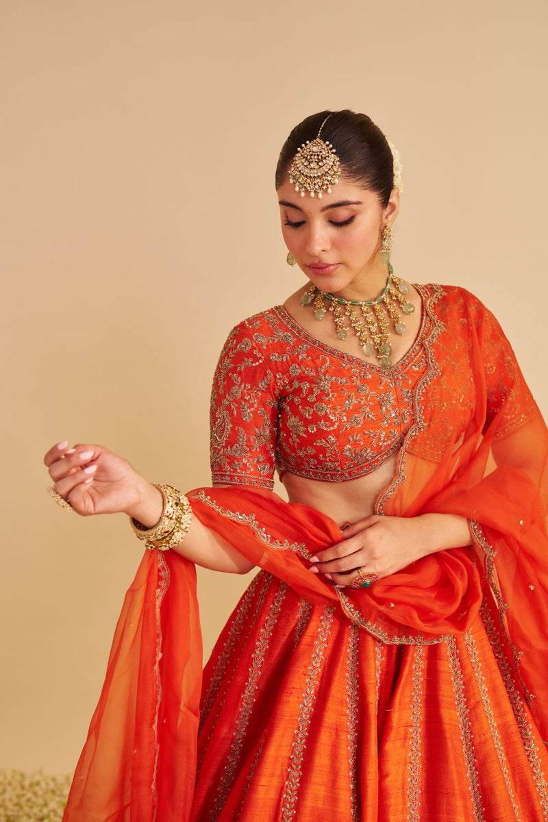 Naazila - Dabka Zardozi Embroidered Raw Silk Burnt Orange Lehenga Set silk by SHEETAL BATRA in orange color for women in Singapore