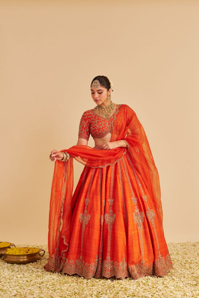 Naazila - Dabka Zardozi Embroidered Raw Silk Burnt Orange Lehenga Set silk by SHEETAL BATRA in orange color for women in Singapore