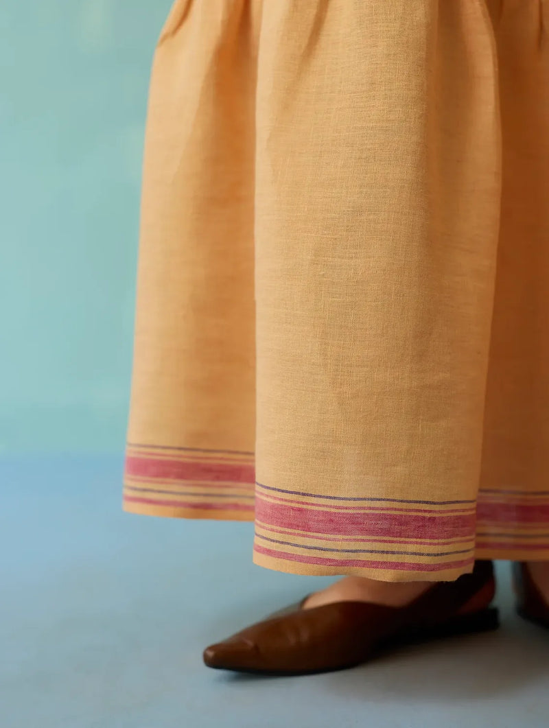 Pera Border Linen Tiered Dress - Apricot linen dress by Manan in apricot for women in Singapore