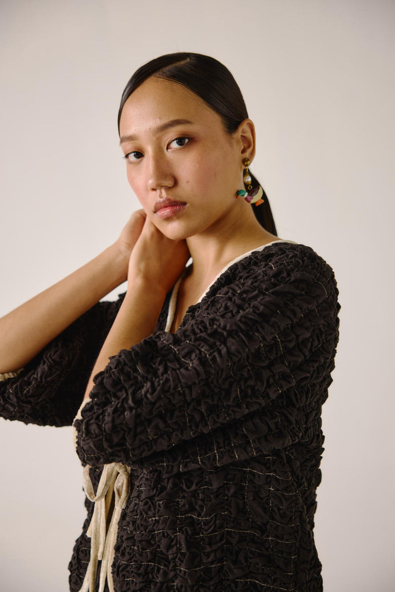 Ruffled top-Black cotton by CORD for women in Singapore