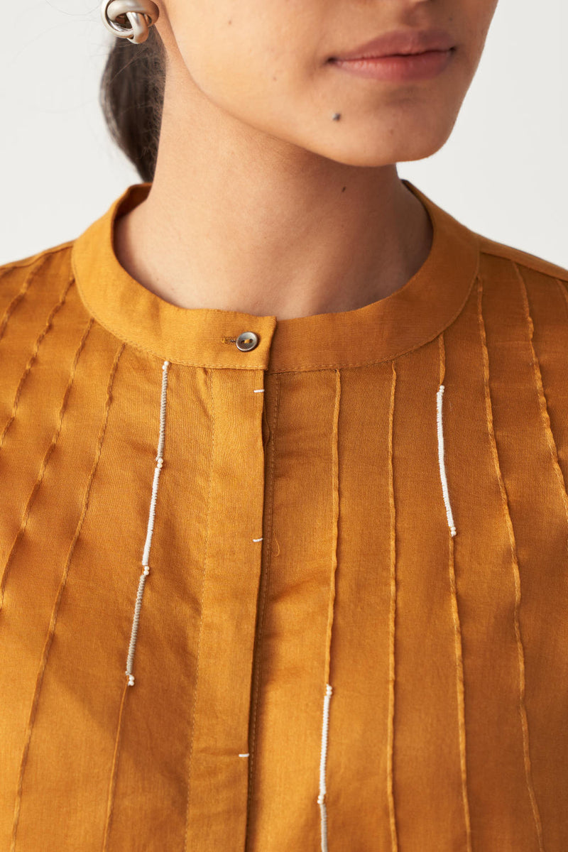 PINTUCK BAT SLEEVE TOP-MUSTARD chanderi by THREE in mustard color for women in Singapore
