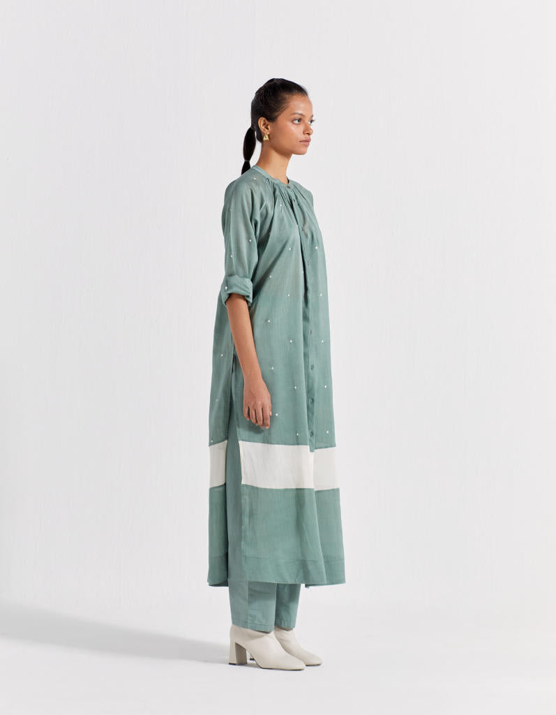 PANEL GATHER NECK SHIRT - JADE POLKA chanderi by THREE in mint color for women in Singapore