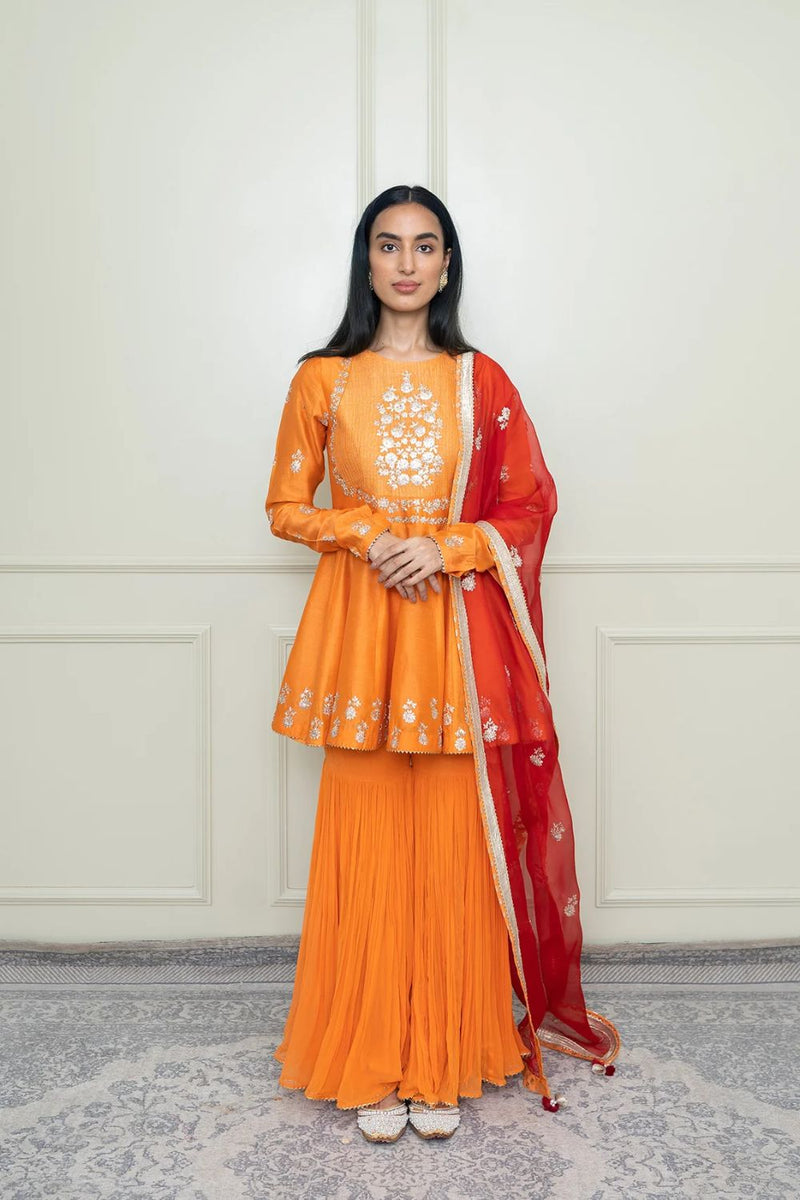 Shahana Peplum kurta with garara and dupatta-Pumpkin orange & scarlet red silk by SHEETAL BATRA in orange color for women in Singapore