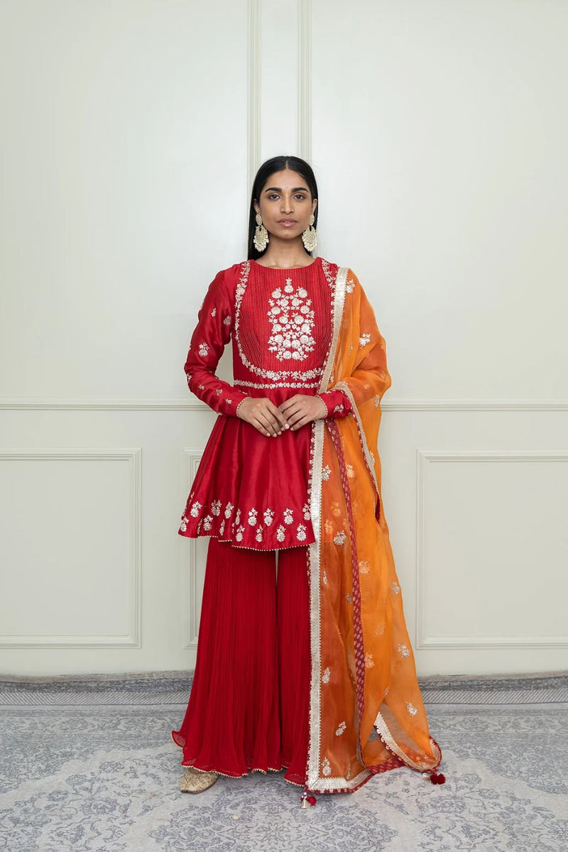 Shahana Peplum kurta with garara and dupatta-Scarlet red & pumpkin orange silk by SHEETAL BATRA in red color for women in Singapore