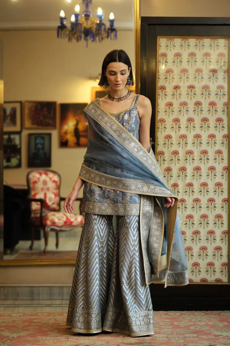 ‘Shama’ Banarasi munga silk chevron gharara georgette kurta/kurta set by Malika Mathur in blue grey for women in Singapore