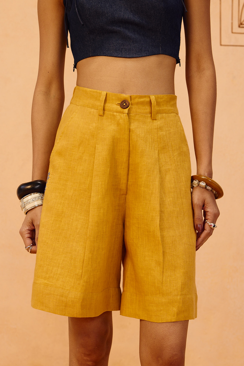 The Golden Linen Shorts 100% linen short by SUI in mustard for women in Singapore