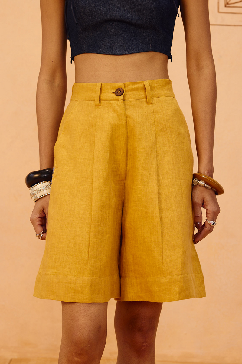 The Golden Linen Shorts 100% linen short by SUI in mustard for women in Singapore